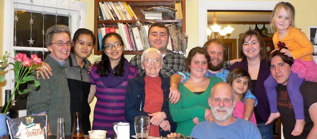 Family picture during Christmas 2010. (from left to right) Susan Barnes Whyte; Linh Tang and Tang’s sister; Susan’s mom, Ann; Susan’s son, Jeremy; Irv’s daughter, Oona; Irv’s son, Morgan; Irv; Irv’s granddaughter, Xander; Susan’s daughter, Hallie; Susan’s son-in-law, Giovanni; and Irv’s granddaughter, Cadence.