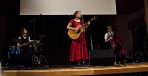 Performers of the touring Muses’s Market play live music focused on sustainability and environmental issues during an April 20 Earth Week event in Ice Auditorium. Megan Myer/Online editor
