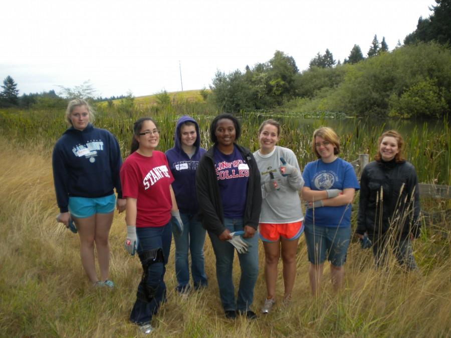 A group of students volunteer at Miller Woods, doing their part in serving the community as well as participating in an annual campus event Sept. 17. Photo courtesy of Kit Crane