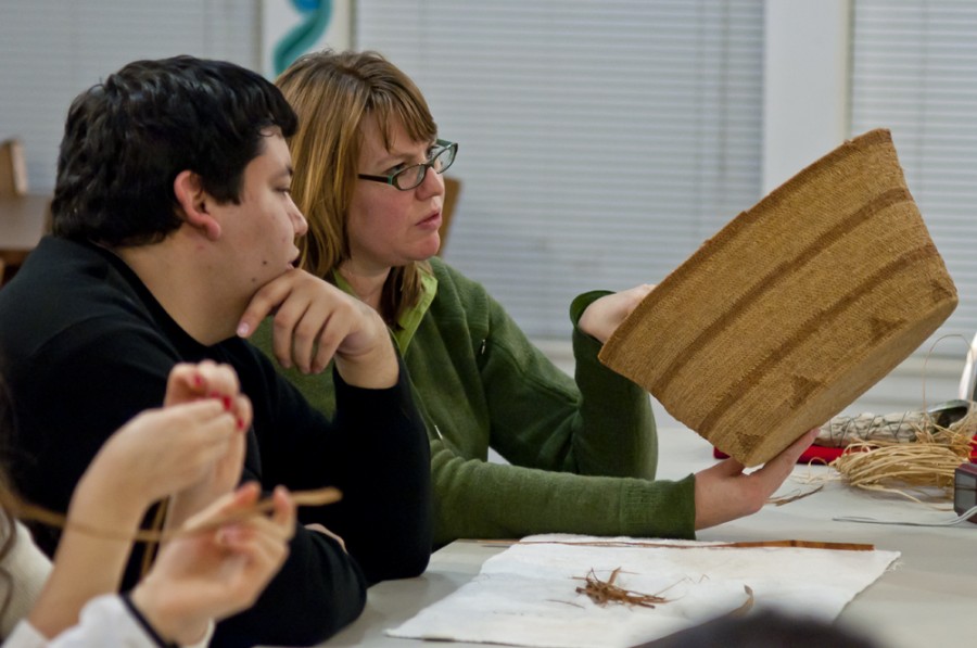 Participants admire one of the baskets that guest Stephanie Wood showed during the cultural workshop Nov. 30 in Withnell Commons. Joel Ray/Photo editor