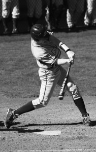 Junior Kramer Lindell makes contact with the ball as Linfield
proceeds to a 4-3 win over Willamette University on March 9. Lindell scored one of four runs for the Wildcats. Tyson Takeuchi/Senior photographer