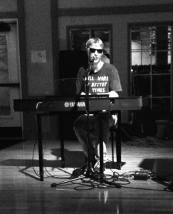 Junior Max Milander performs an original piece titled “Frost Bitten Grass” at the open mic Cat Cab on Feb. 28 in the Fred Meyer Lounge. Sarah Mason/Staff writer