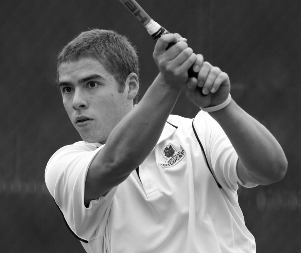 Sophomore Lukas Kleinman hits the ball back to his opponent during the match against Willamette University on April 12. Kleinman won his singles match, 10-7. Photo courtesy of Sports Information