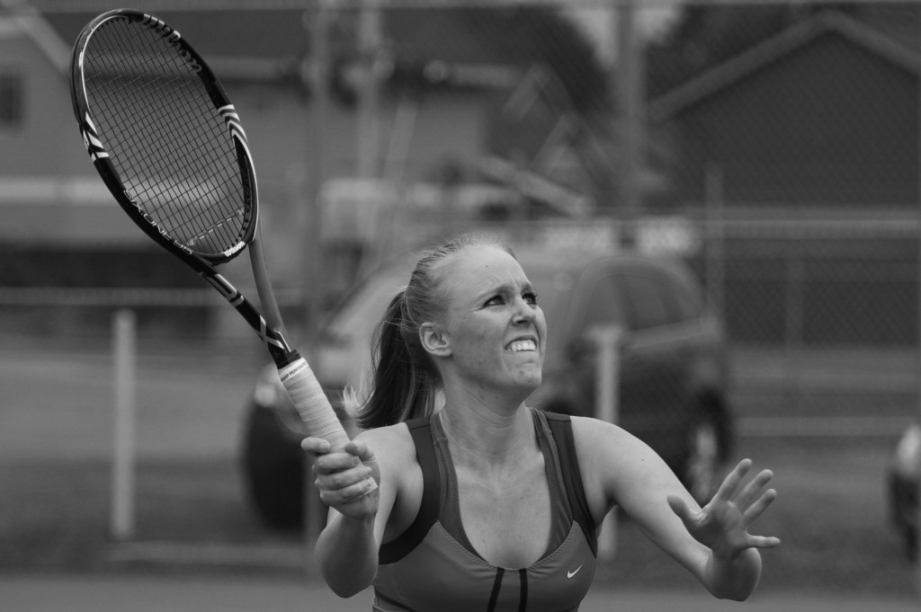 Senior Lexi Thomas goes in for a poach at the net against Rachel Heringer and Stephanie Matsuura in a 9-8 (7-2) number two doubles victory against Willamette University with partner sophomore Gretchen Jernstedt on April 12. The Wildcats won the match 8-1 against the Bearcats. Tyson Takeuchi/Senior photographer