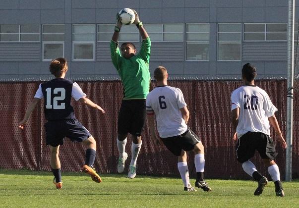 Men’s soccer fights its way to a win