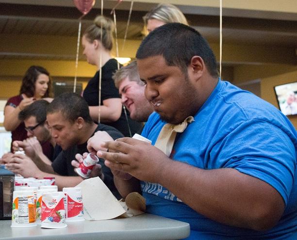 Students eat yogurt to compete for a cure