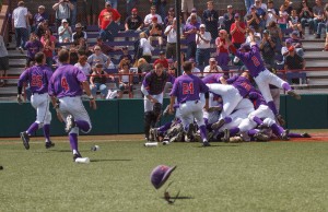 Spencer Beck/ For the Review The Linfield baseball team celebrates its 4-2 win against UW-Stevens Point on May 17 at home. This win catapulted the ’Cats toward the Division III national title. 
