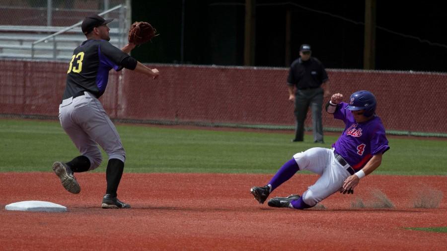 Spencer Beck/ For the Review 
Junior shortstop Corey VanDomelen steals second base at the bottom of the first inning against UW-Stevens Point. This was one of three hits that VanDomelen got in the game.