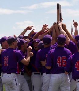 Spencer Beck/ For the Review Linfield baseball team players embrace after winning the regional tournament and securing a spot to compete for the Division III title.