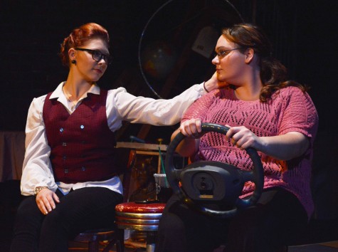 Josie Tilbury/For the Review  Kate, played by freshman Emma Coleman, strokes her lover's cheek, played by sophomore Alyssa Lawrence, in "Final Approach". 
