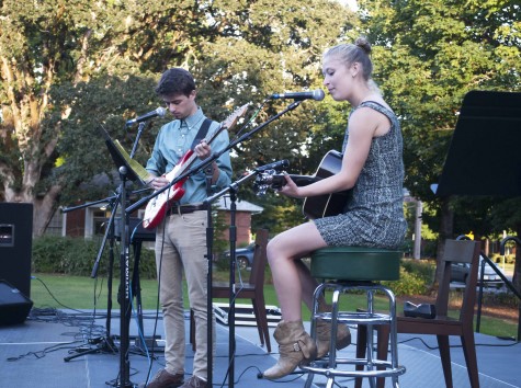 Katelyn Henson/ For the Review. Sophomores Conner Wells and Katie Higinbotham perform at A Night of Music, Friends and Entertainment on Aug. 29 in the IM Field. 
