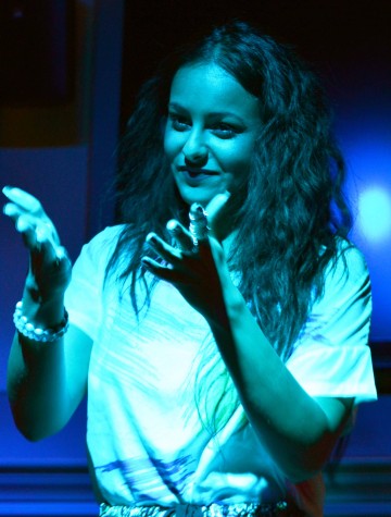 Josie Tilbury/For the Review Jinahie lays down her spoken word poetry in the Fred Meyer Lounge. She focused on interacting with the crowd and creating a warm environment where people would feel confident when sharing stories of their own. 