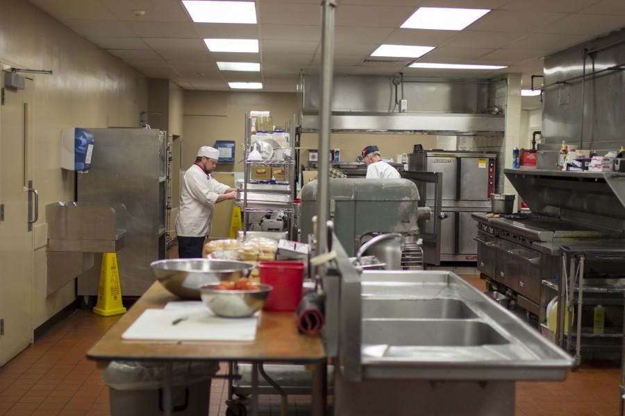 Behind the walls of the dining hall cafeteria, chefs and bakers prepare for the next meal. 
