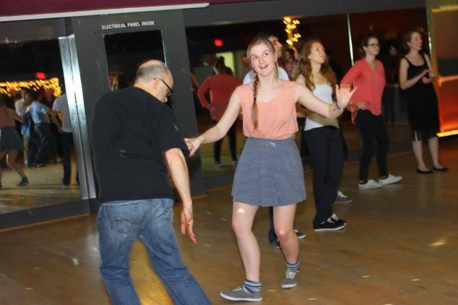 Elia Samms moves to the beat while learning how to swing dance.