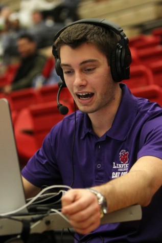 Senior Mass Communication major Kevin Nelson provides commentary in his broadcast at a Linfield basketball game.