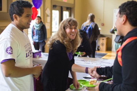 Debbi Harmon Ferry, director of alumni and parent relations and Achmat Jappie '16 great students at Linfield's birthday party.