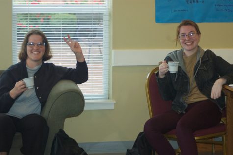 Kaitlyn Fieldhouse (left), Elizabeth Loukas (right) enjoy a cup of tea at the Queer tea event