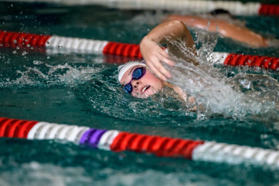 Claire St. Marie, 19, swimming the 1000m freestyle against Lewis & Clark.