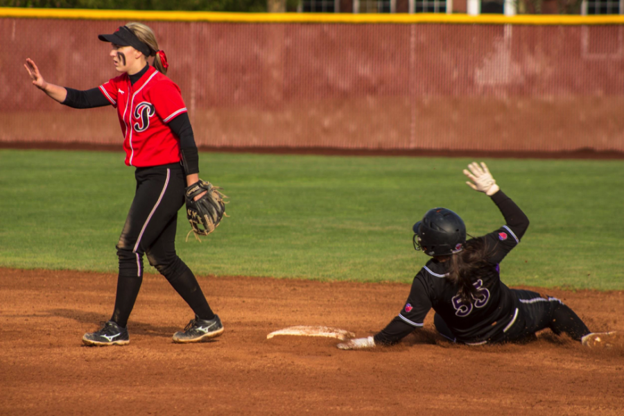 Chelsea Horita, ‘20, (#55) slides past Pacific second baseman Trisha Snyder for the steal.