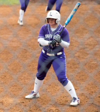 Senior Melanie Oord at bat in a home game.