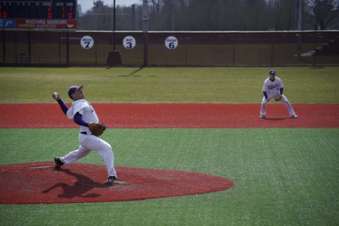 Cason Cunningham, ‘19, winding up his pitch in game one of the Willamette Bearcats series with Alec Cook, ‘19, on first base.