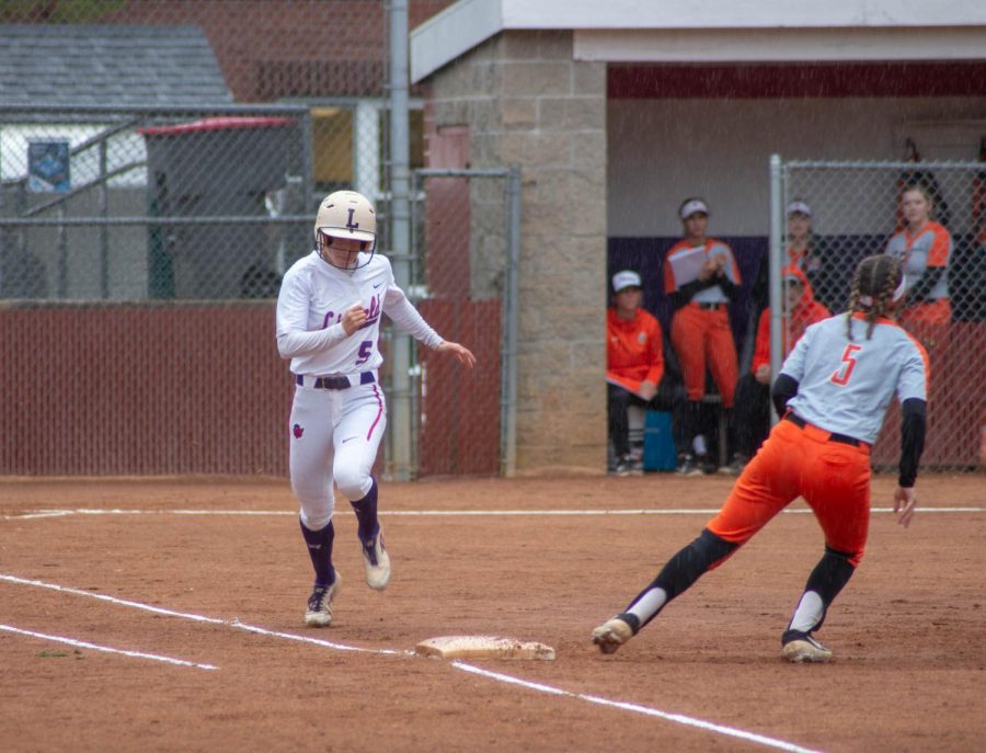 Kelsey Wilkinson, ‘20, successfully making it to first base with time to spare.