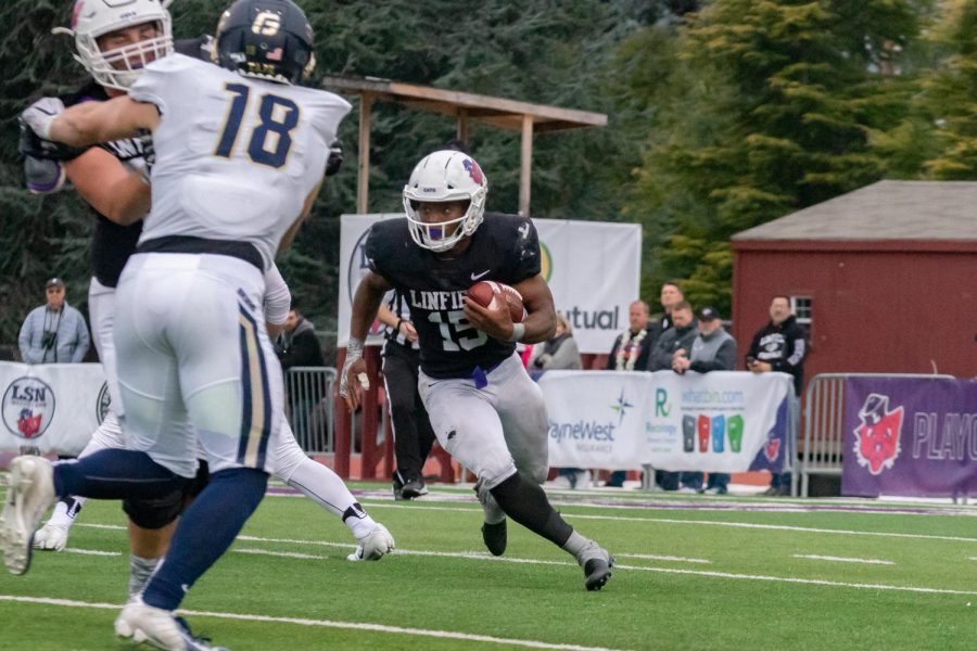 Sophomore running back Artie Johnson rushing during win over George Fox. 