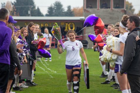 Senior Lauren Frost walking down the field for her final soccer game at Linfield College.
