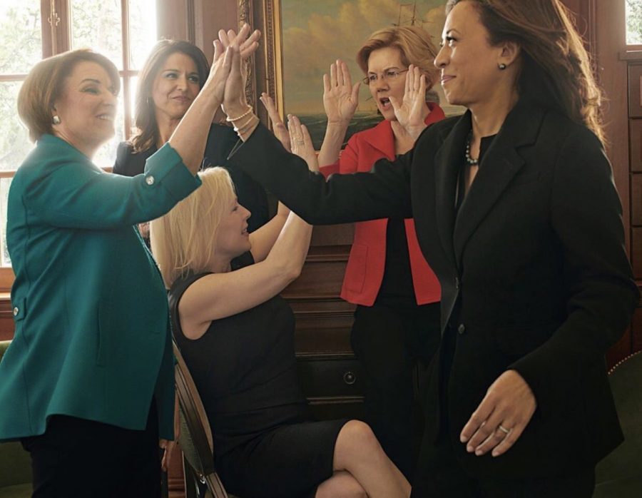 Five of the female presidential candidates pass around some high-fives