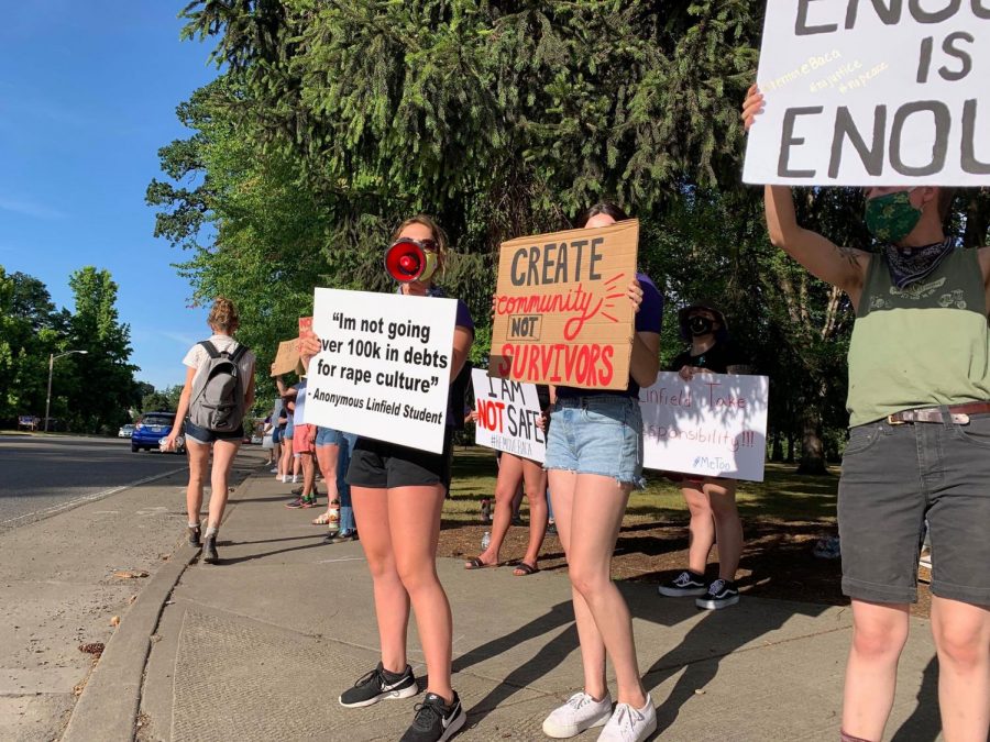 Protesters+were+encouraged+to+stand+in+marked+spaces+that+were+measured+6ft.+apart.+Pictured+is+McKenna+Mussner%2C+a+senior+environmental+science+major%2C+leading+a+chant+with+her+fellow+students.+Mussner+combined+forces+with+two+other+women+to+organize+and+bring+the+event+to+fruition.
