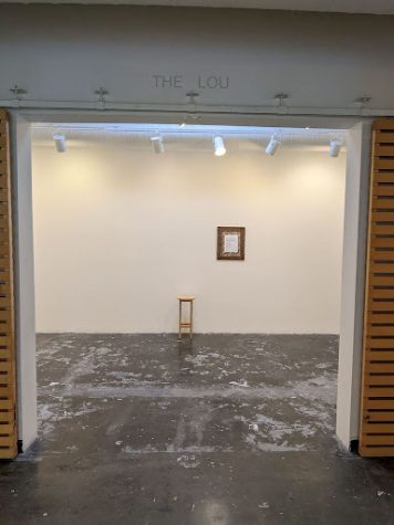 The “No Show” Show –  a single stool, where the collages had last been seen, alongside a note explaining the blank walls (Camille Lubach)