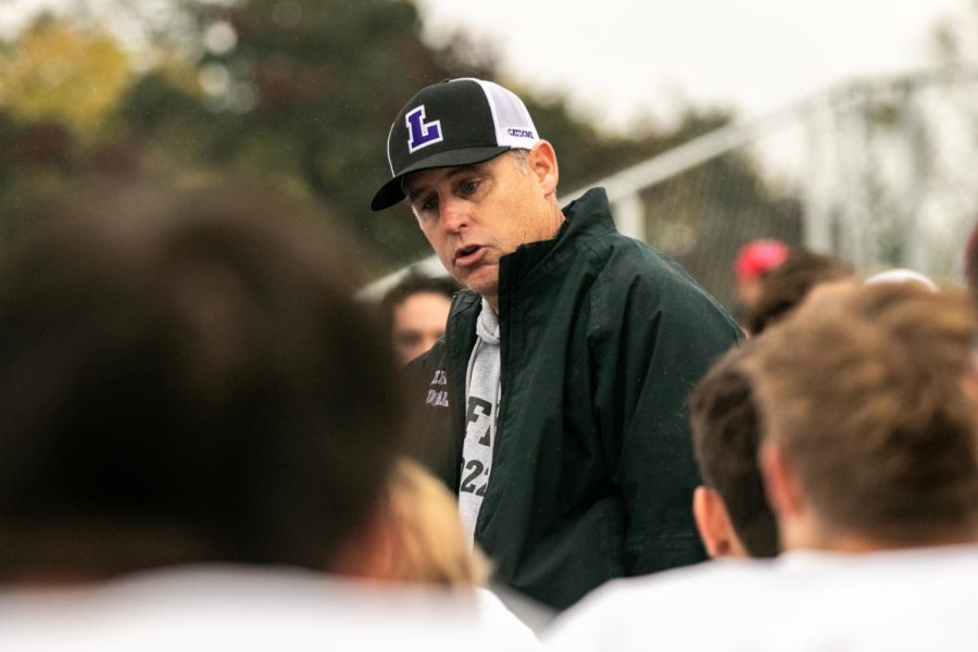 Head coach Joseph Smith talks to players post game.