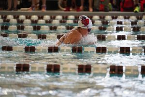 Averill competes in breaststroke. 