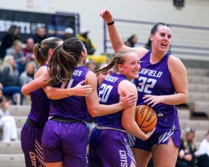 The Wildcats celebrate a win. 