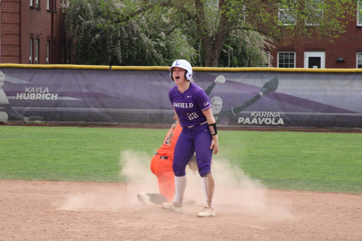 Senior Ashlyn Aven (20) gets to second base against Lewis and Clark on April 11, 2026.