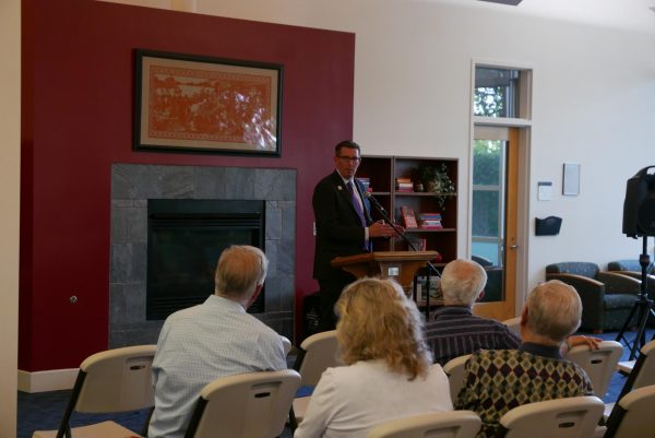 President Mark Blegen speaking at a Linfield event in the library.