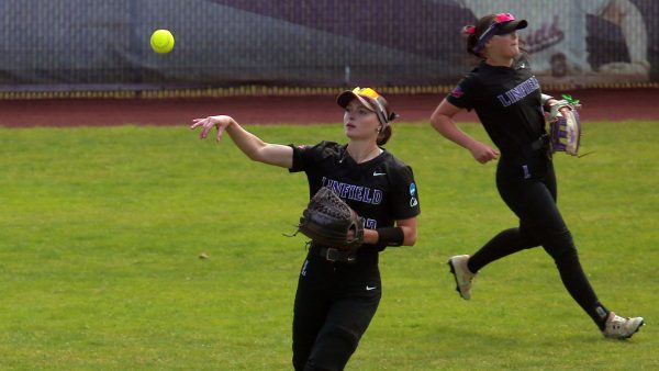 Meara Sain (33) throws the ball back in after catching a flyout